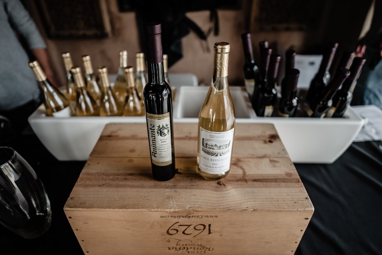 a wooden box filled with bottles of wine